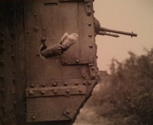 messenger pigeon being released from WWI-era tank portal